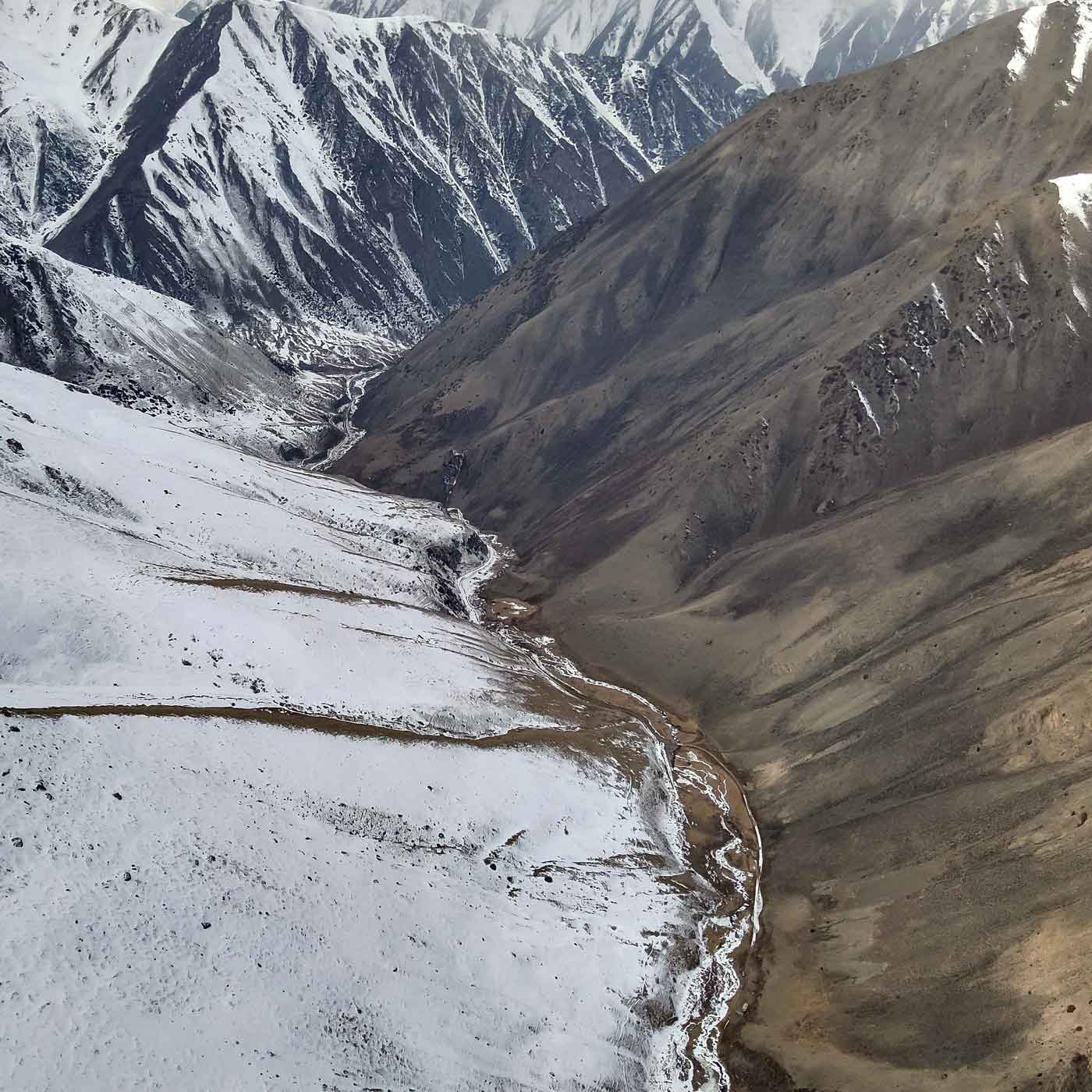 Snow and sunny side of valley.